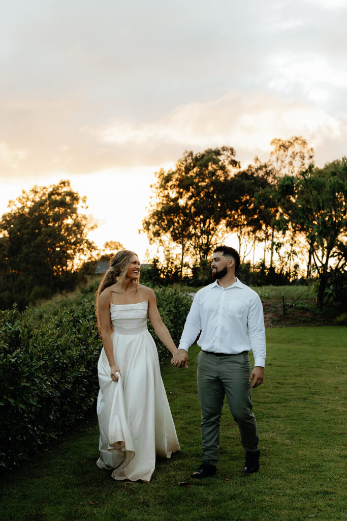 newly married couple holding hands