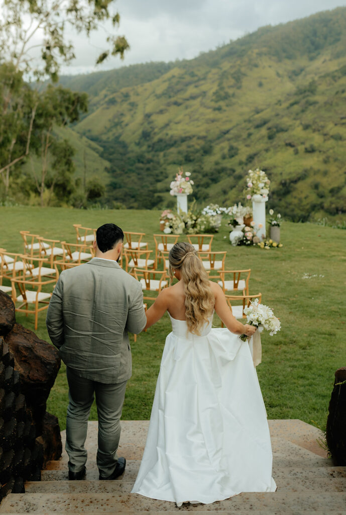 bride and groom walking to the altar