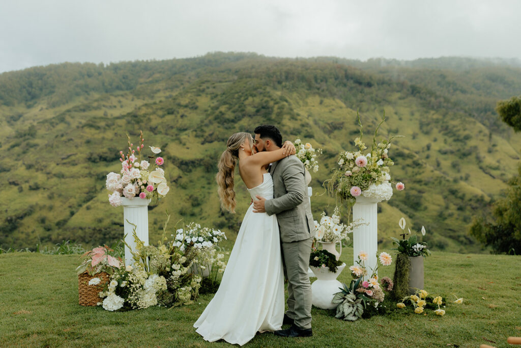 bride and groom kissing after their wedding ceremony