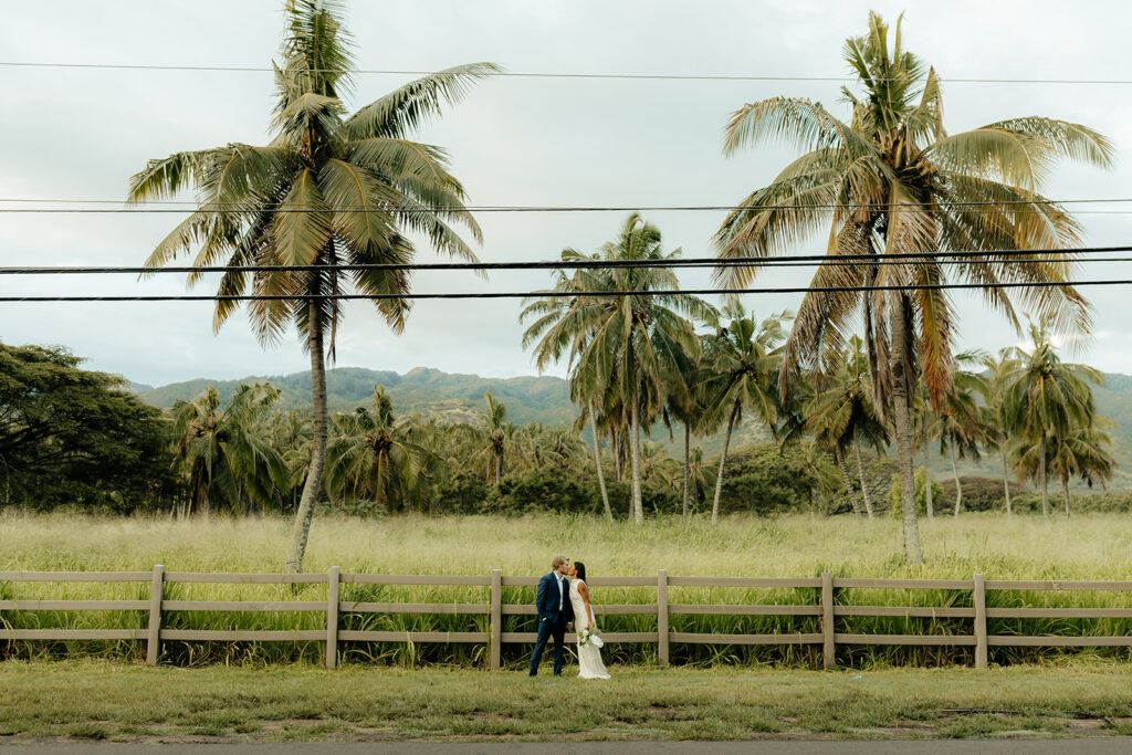 bride and groom kissing during their photoshoot