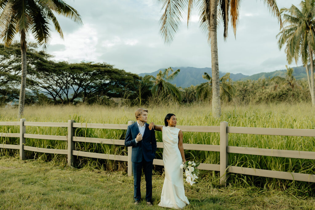 cute portrait of the newly eloped couple under the palm trees