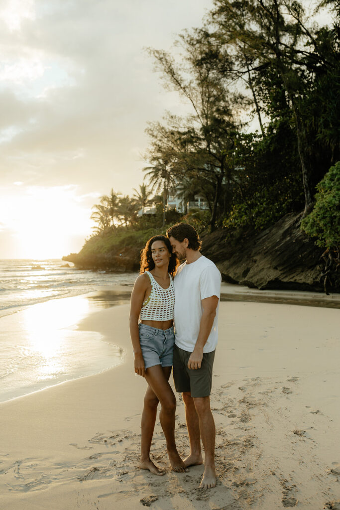 couple kissing during their sunrise photoshoot 