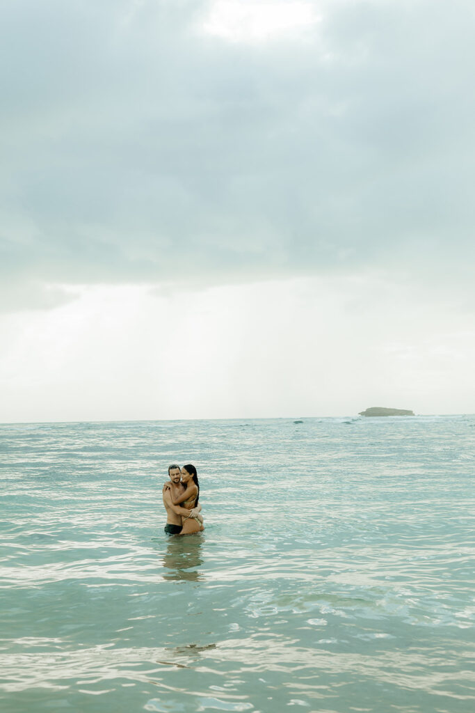 couple swimming in oahu, HI