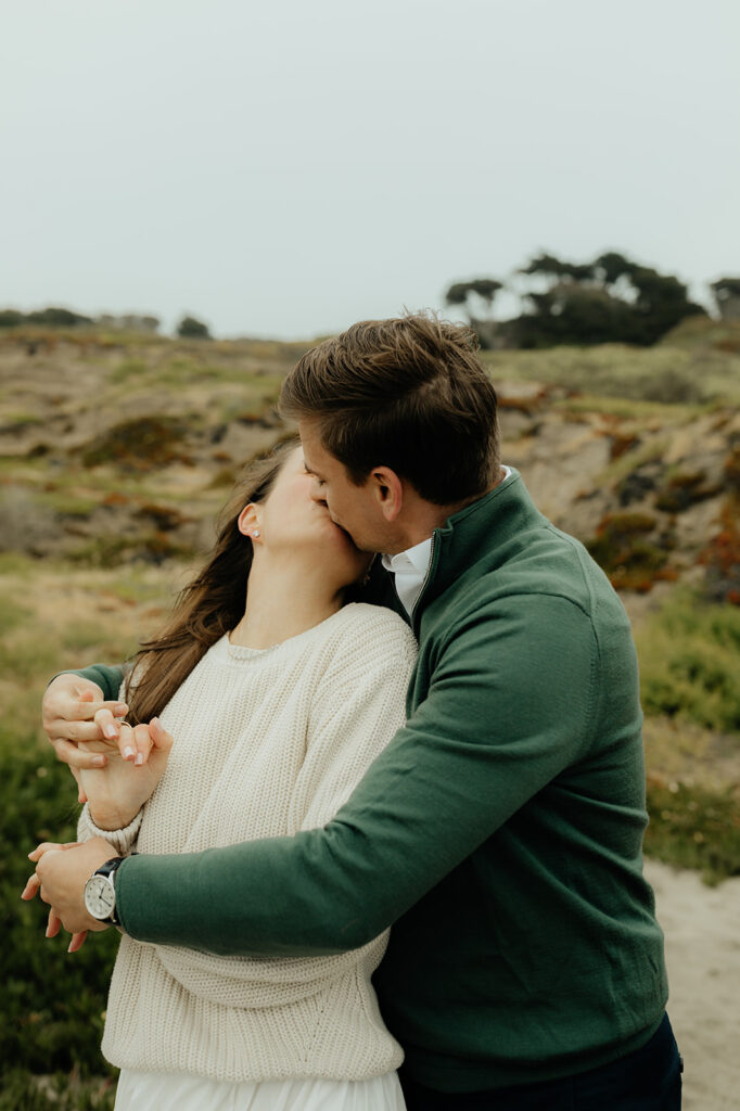 couple kissing during their ethereal engagement session