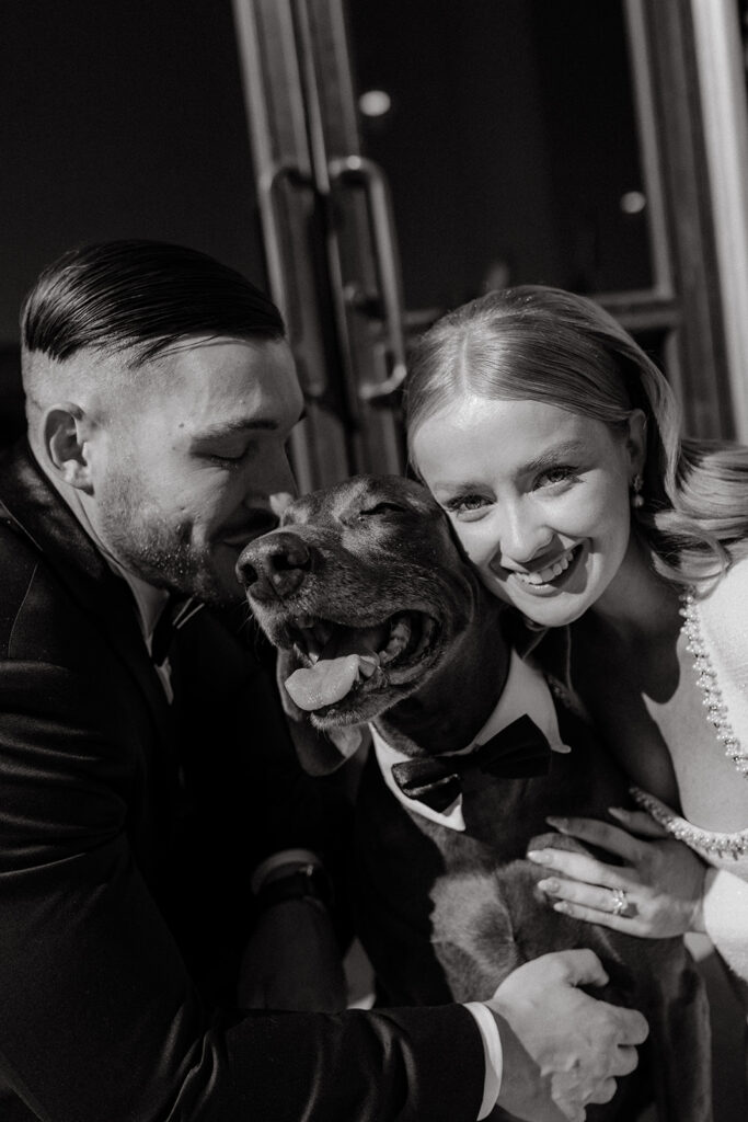 San Francisco City Hall Elopement outside front doors couple with dog in tuxedo