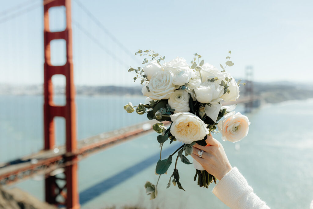 white bouquet in front of golden gate bridge