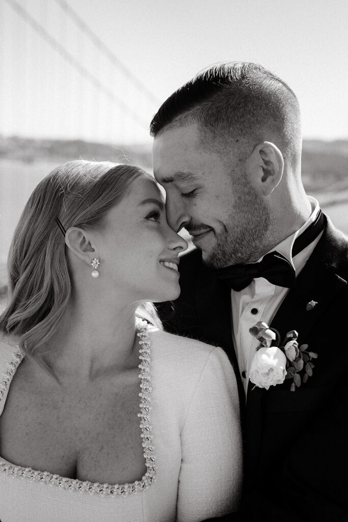 Elopement Couple at San Francisco Golden Gate bridge looking at each other
