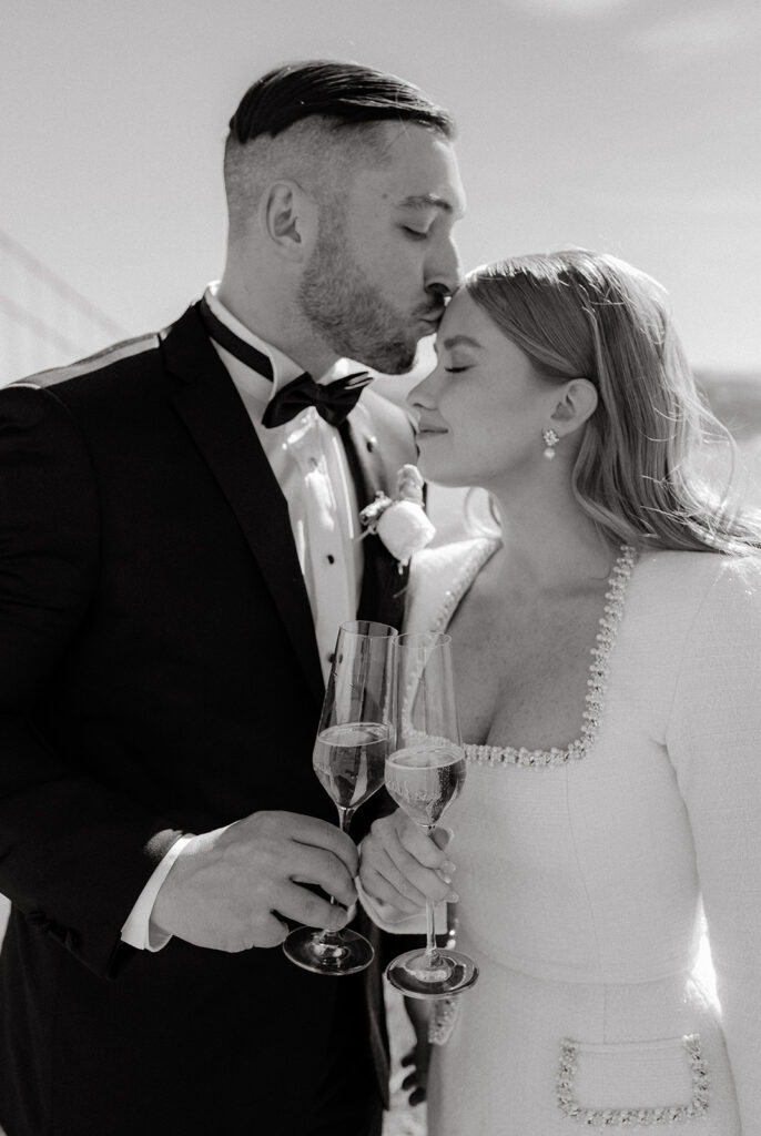 Elopement Couple at San Francisco Golden Gate bridge with champagne