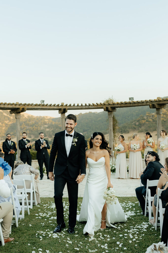 Clos LaChance Wedding ceremony bride and groom walking down aisle