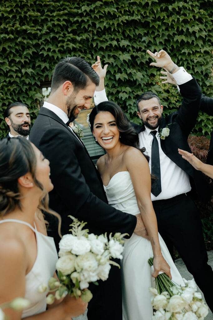 Clos LaChance Wedding - Bride and groom happy with wedding party
