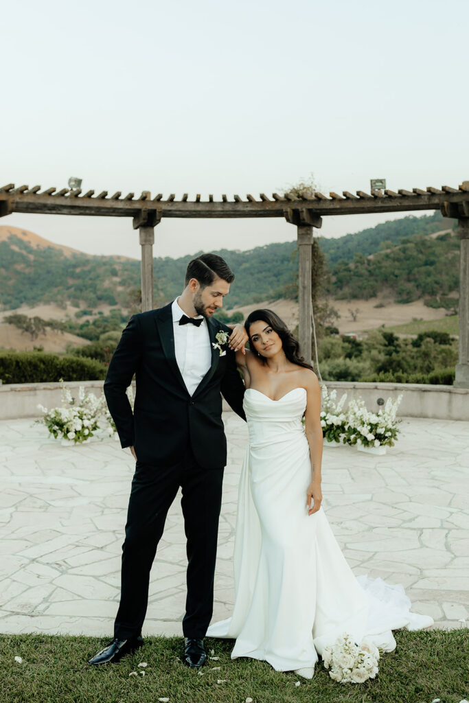 Clos LaChance Wedding - bride and groom with bride's hand on grooms shoulder pose