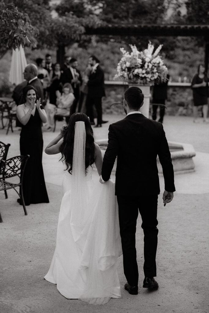 Clos LaChance Wedding - bride and groom walking into reception
