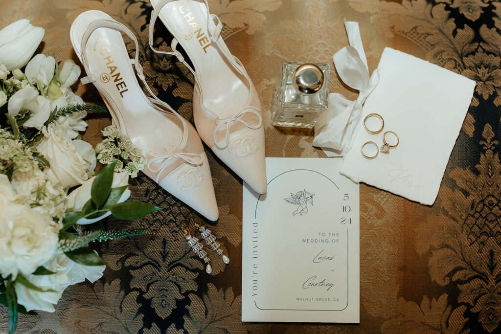 wedding detail flat lay with chanel heels
