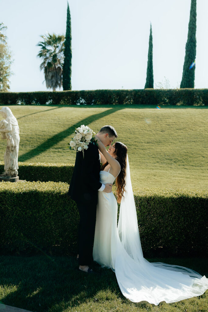 Grand island mansion wedding couple photos with statue