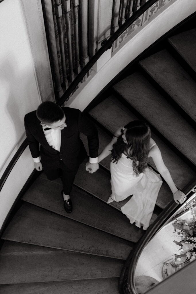 Grand island mansion wedding couple photos walking down stairs