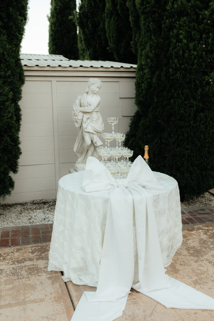 wedding champagne tower with large white bow