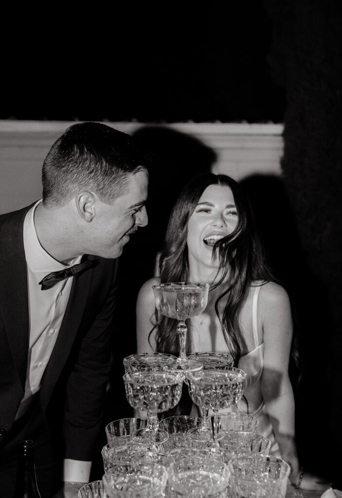 Grand island mansion wedding chic couple in front of champagne tower